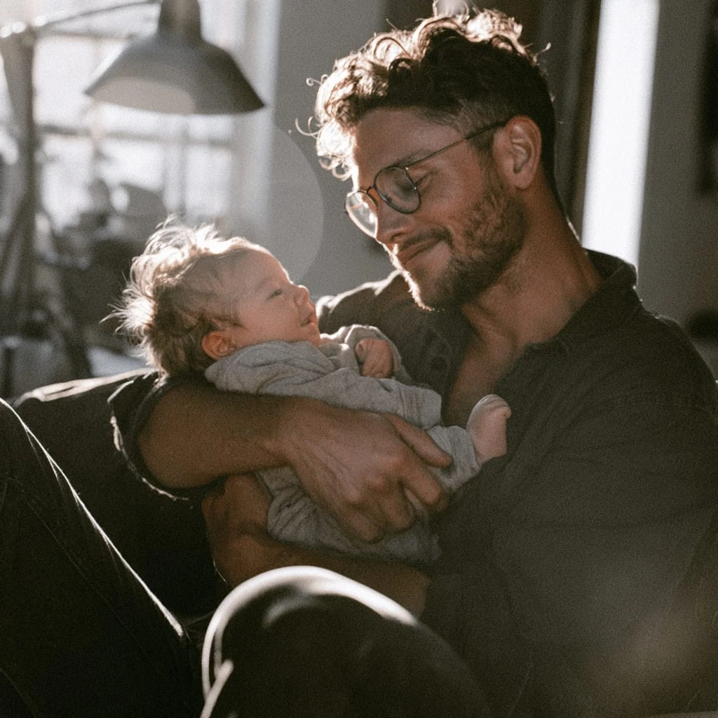 A new father holding his baby