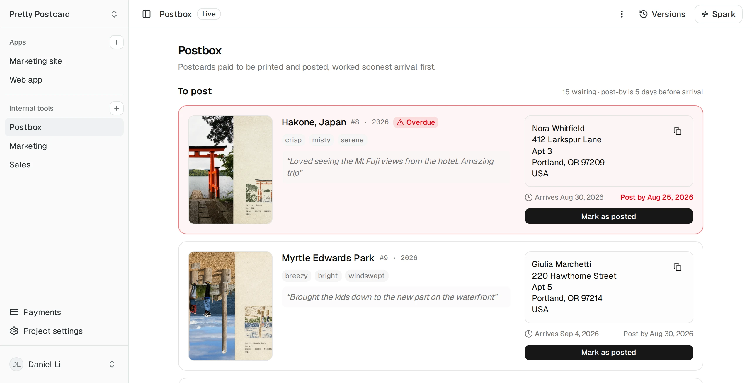 PrettyPostcard's Postbox tool: paid postcards waiting to be mailed, each with its address and a Mark as posted button
